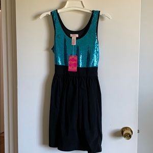 Candie’s sequin dress with black skirt